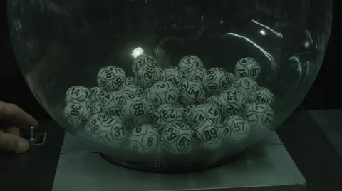 LOTTERY BALLS TUMBLING INSIDE A PLEXIGLAS SPHERE Stock Footage 44443738