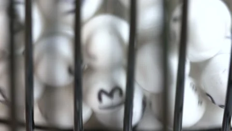 Lottery balls tumbling inside a randomizer. Stock Footage 156865897