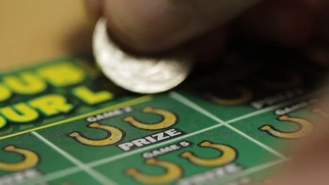 Lottery ticket scratch off close up Stock Footage 94316792