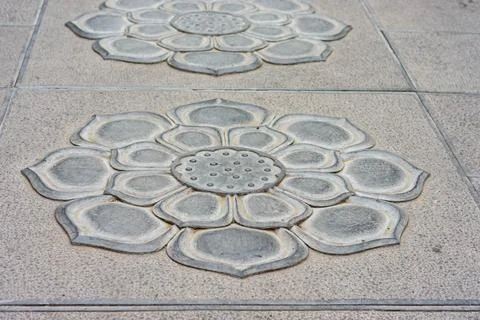 Lotus Flower Relief Pattern on Stone Pavement Stock Photos