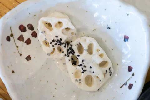 Lotus root boiled down in soy sauce or other seasonings. Stock Photos