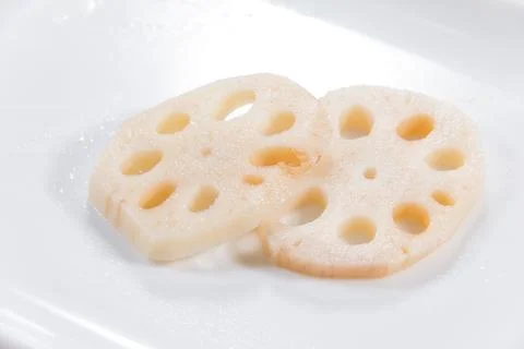 Lotus root slices moist surface Foto stock