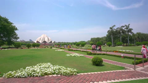 Lotus Temple modern architecture surrounded by green gardens in New Delhi India Stock Footage 342269521