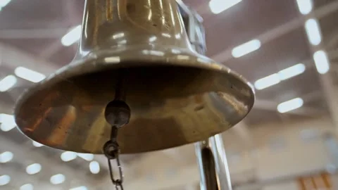 Loud ringing of the gong bell during a martial arts competition in a gymnasium Stock Footage 310877898