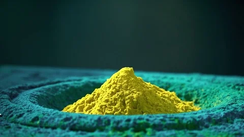Loudspeaker throws yellow and blue powder in the air, super slow motion shot Stock Footage 78701640