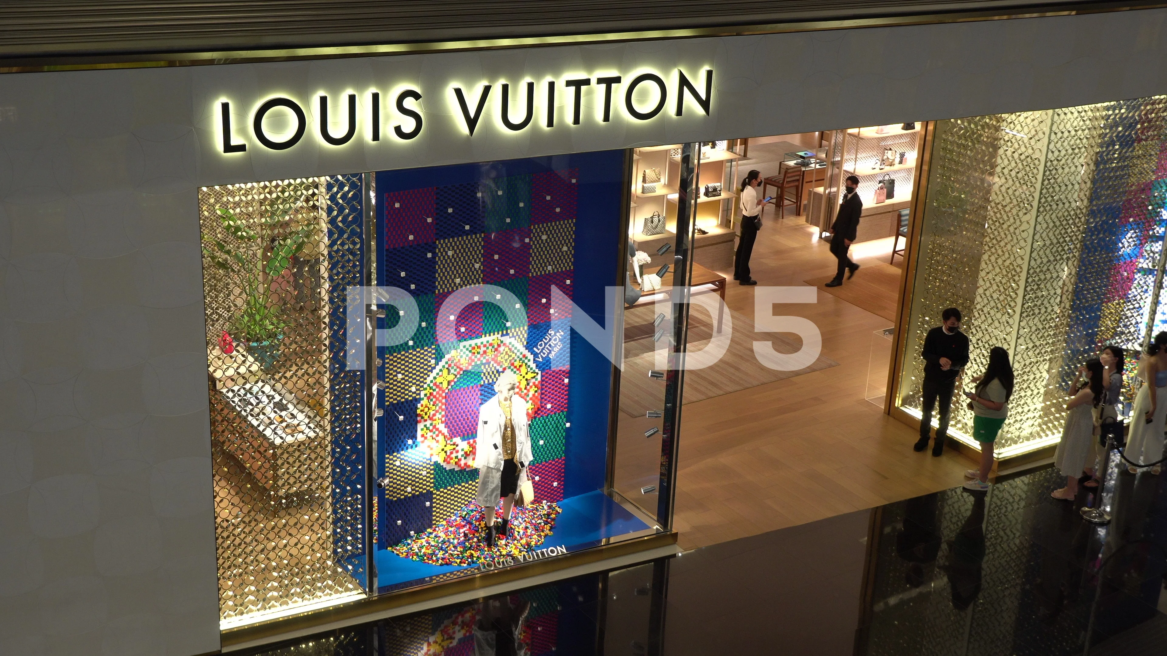 Louis Vuitton store window in mall in Bangkok, Thailand Stock
