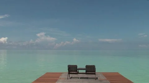 Lounge chairs overlooking ocean Stock Footage 47862169
