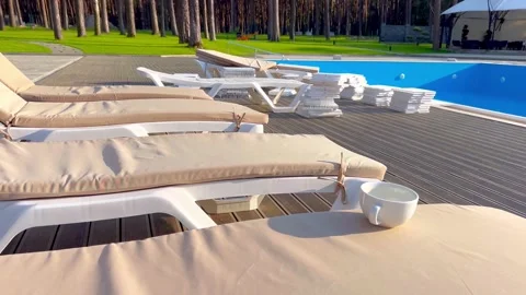 Lounge chairs for relaxing and sunbathing Stock Footage 310316400