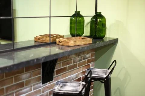 Lounge, stylized as a bar. Corner worktop against the wall. Stock Photos