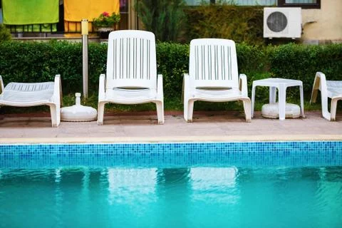 Loungers by the pool Stock Photos