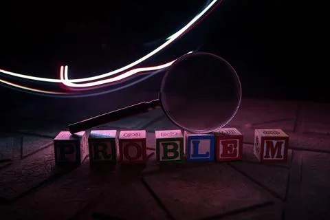 Loupe analysing the word "problem" in front of a white background Stock Photos