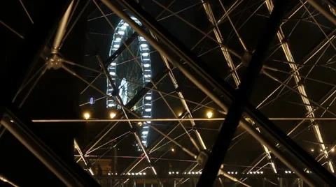 Louvre museum pyramids see-through amusement-park-night Stock Footage 27449295