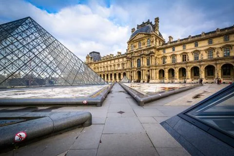 The Louvre Pyramid, in the courtyard of the Louvre Palace, in Paris, France. Stock Photos
