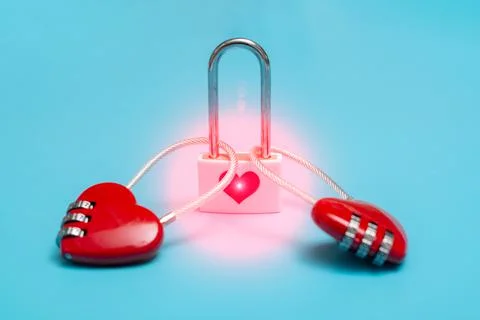 Love affection, attraction, connection. Two hearts in the form of locks on a  Stock Photos
