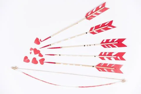 Love arrows aiming small red hearts Stock Photos