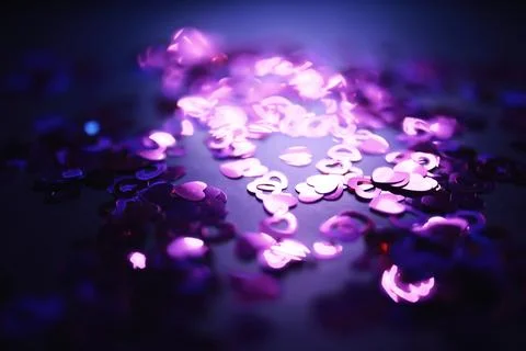 Love background. Red beads in the shape of a heart on a glitter and bokeh b.. Stock Photos