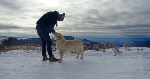 Love between man and his dog, in winter spending time together Vídeo Stock 88323238