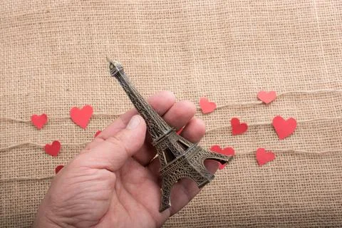 Love concept with Eiffel tower and paper heart on threads 스톡 사진