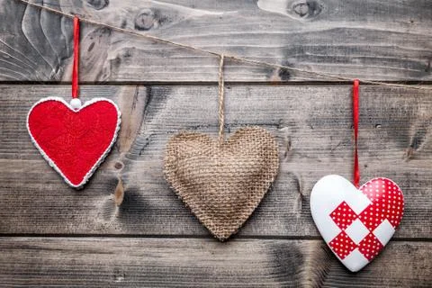Love concept. Hearts hanging on a string Stock Photos