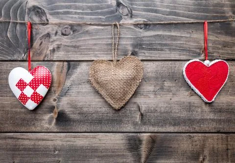 Love concept. Hearts hanging on a string Stock Photos