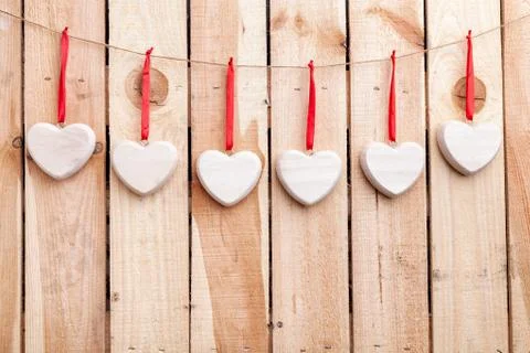 Love concept. Hearts hanging on a string Stock Photos