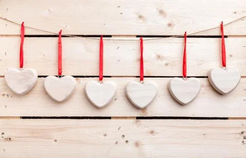 Love concept. Hearts hanging on a string Stock Photos