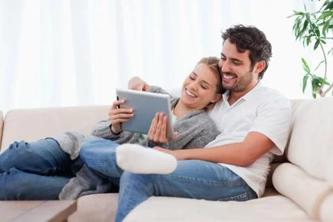 In love couple using a tablet computer Stock Photos