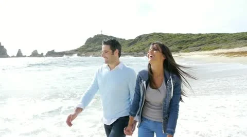 In love couple walking by the beach Stock Footage 14827486