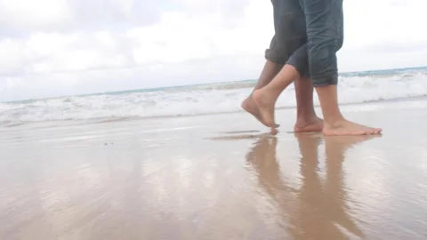 LOVE COUPLE WALKING DOWN THE BEACH Stock Footage 218211921