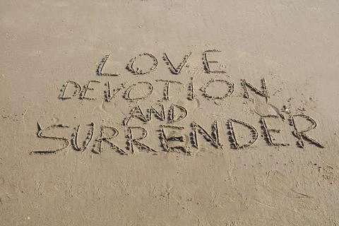 Love, Devotion, and Surrender – A Message in the Sand Stock Photos