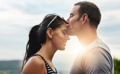 Love doesnt get sweeter than this. a young man affectionately kissing his Stock Photos