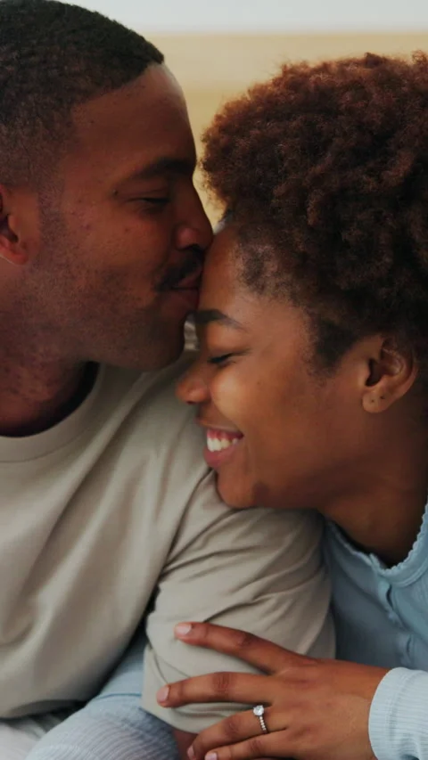 Love, happy or couple on bed with kiss, partner trust or bonding together in Stock Footage 340779849