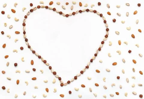 Love heart gift, composition of nuts, food background Stock Photos