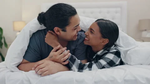 Young Funny Couple In Underwear Fighting With Pillows In The Bed
