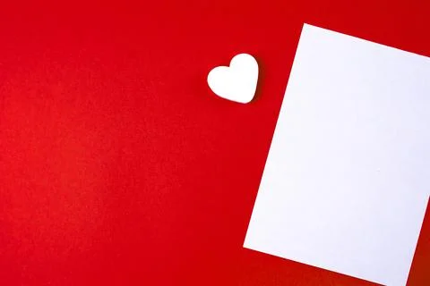 Love letter mock up template. Empty blank white paper on red paper background Stock Photos