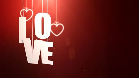 LOVE letters hanging on string falling from the ceiling with red backgound Stock Footage 105962300