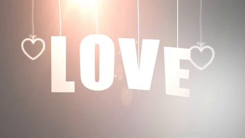 LOVE letters hanging on string falling from the ceiling with white backgound Stock Footage 105967036