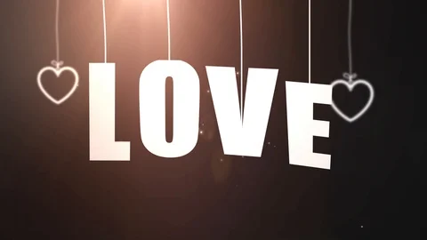 LOVE letters hanging on string falling from the ceiling with black backgound 스톡 동영상 105968035