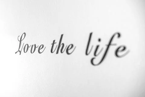 Love the life word phrase on a bright white wall Stock Photos