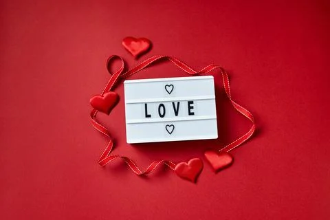 Love lightbox message with red hearts on red background Stock Photos