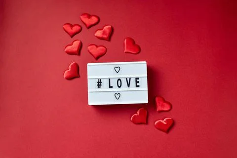 Love lightbox message with red hearts on red background Stock Photos