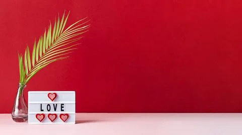 Love lightbox message with red hearts on pink and red background Stock Photos