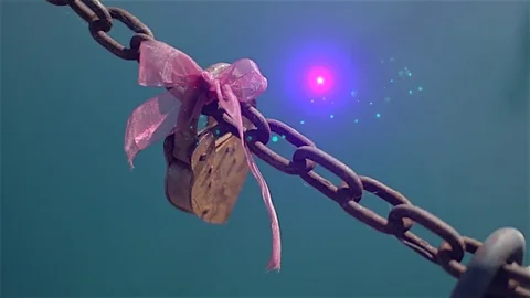 Love Lock | Heart-shaped lock with a pink bow gets a touch of magic - 2 of 2 Stock Footage 83108498