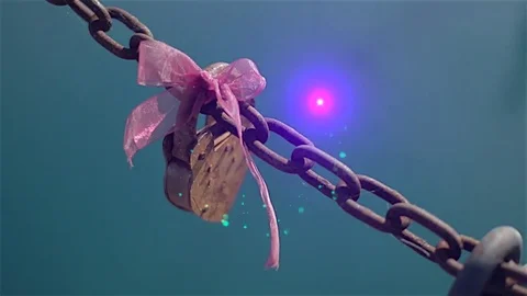 Love Lock | Heart-shaped lock with a pink bow gets a touch of magic - 1 of 2 Stock Footage 83108499