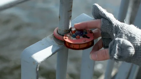 Love lock locked in on the rusty metal railing of the bank of Daugava river in 動画素材 103201864