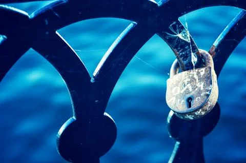 Love lock on the railing of the old bridge close up Stock Photos