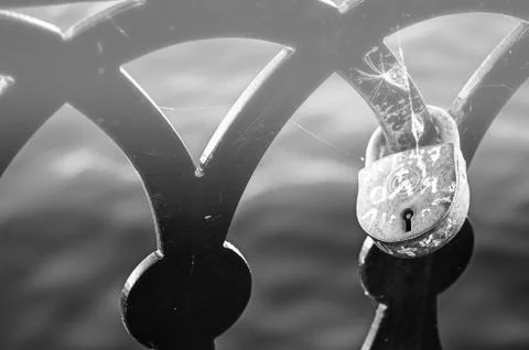 Love lock on the railing of the old bridge close up Stock Photos