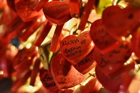  Love locks attached to a bridge symbolize enduring affection and commitme... Foto stock