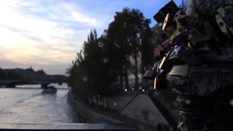 Love Locks attached to the Pont des Arts over the Seine River in Paris, France.  Video stock 256276590