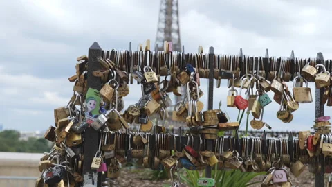Love locks on a bridge in front of the Eiffel Tower. Video stock 278920065